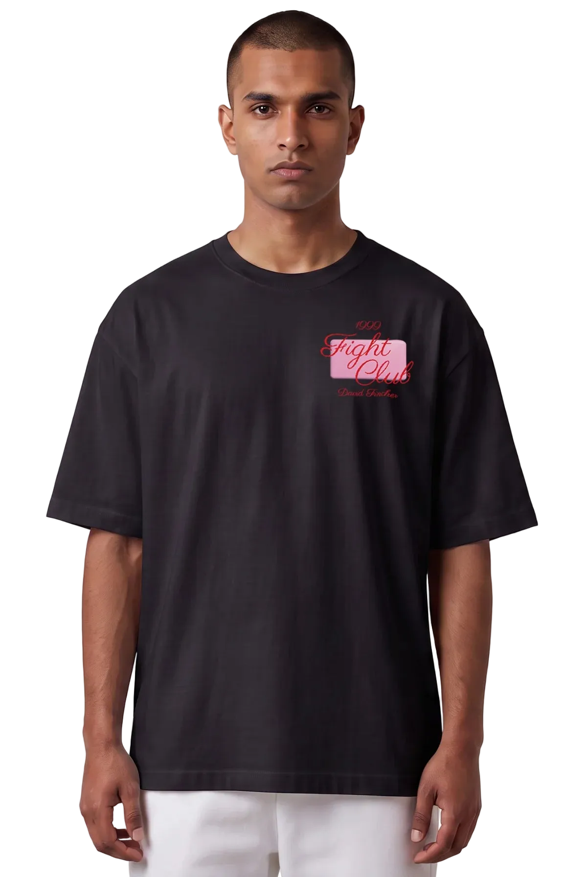 A man wearing an oversized black t-shirt with a pink and red 'The Fight Club' graphic on the left chest, paired with white pants, against a plain white background.