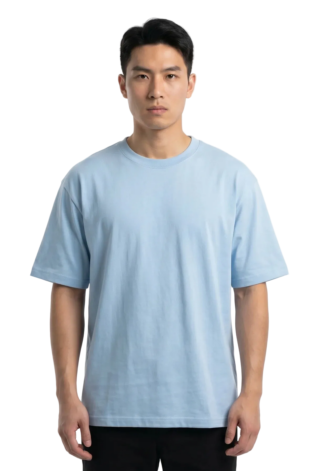 A man wearing a light blue crew-neck t-shirt and black pants, standing against a plain white studio background.