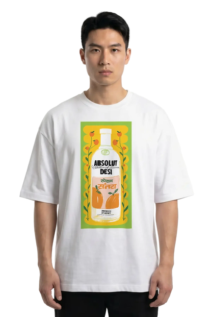 A man wearing a white t-shirt with a large graphic print of an Absolut Desi liquor bottle on the front, set against a plain white background.