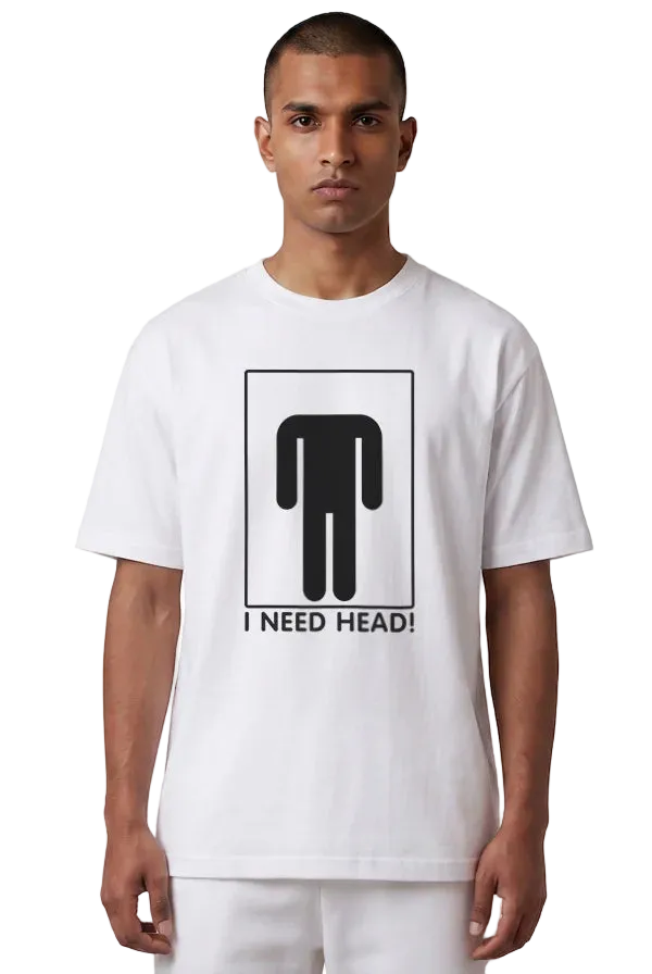 A man wearing a white crewneck t-shirt with a black graphic of a stick figure headless and the text 'I NEED HEAD!' printed on the front, set against a plain white background.