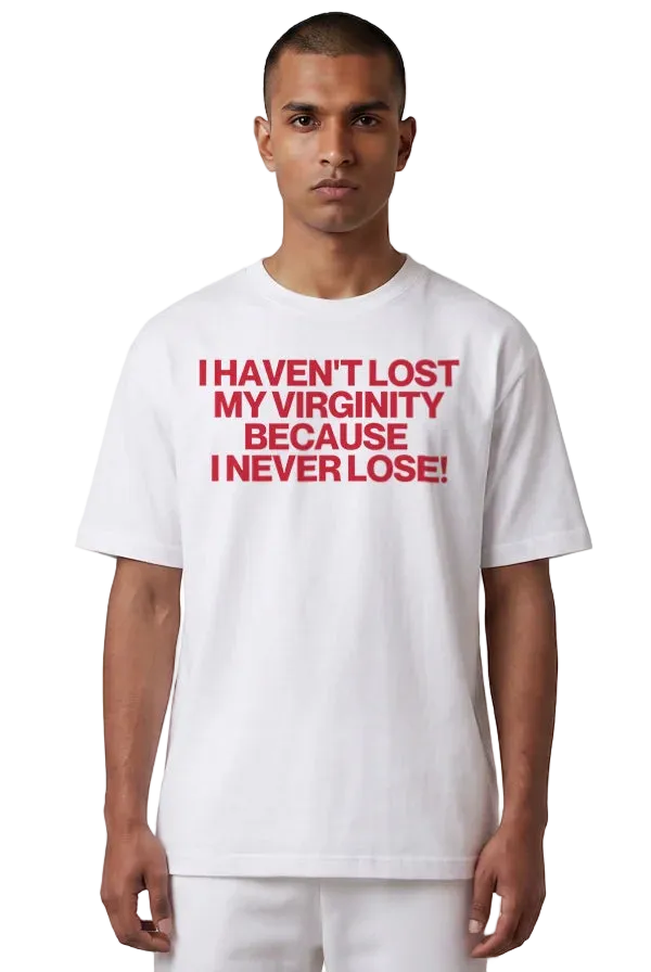 A man wearing a white short-sleeve t-shirt with bold red text on the chest that reads 'I HAVEN'T LOST MY VIRGINITY BECAUSE I NEVER LOSE!'.