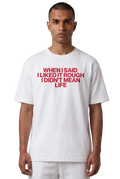A man wearing a white short-sleeve t-shirt with bold red text on the chest that reads 'WHEN I SAID I LIKED IT ROUGH I DIDN'T MEAN LIFE'.