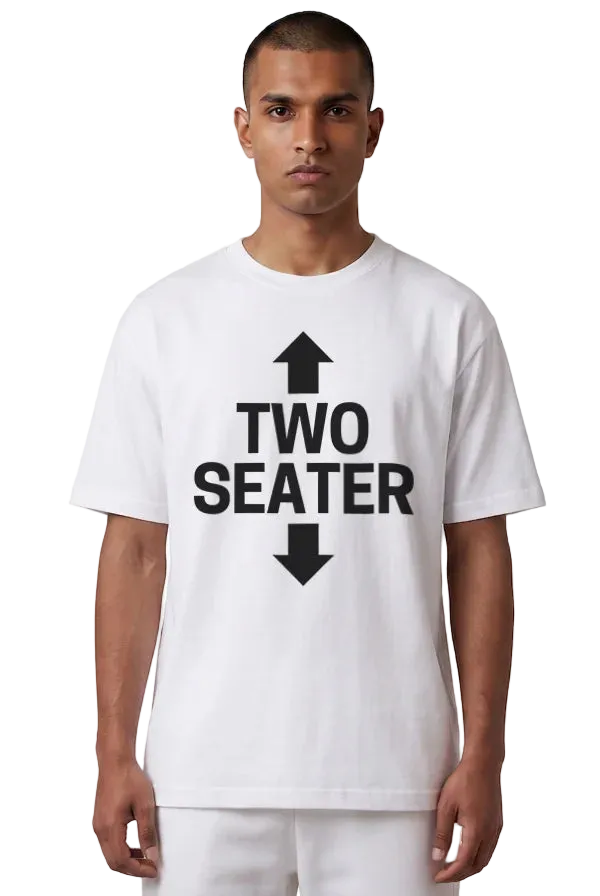 A man wearing a white short-sleeve t-shirt with a bold black graphic print on the front that reads 'TWO SEATER' with arrows pointing up and down, set against a plain white background.